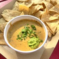 Vegan queso - includes a small scoop of guac inside   at HG SPLY CO in Dallas