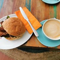 Vegan sausages bap and latte with oat milk (they don't add oat and soya milk as an extra) at The Little Fox Coffee & Bookshop in Whitby