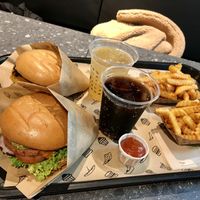 Veclassic & Veganizer burger in a menu with fries and a drink at VINCENT - Hauptbahnhof Hamburg in Hamburg