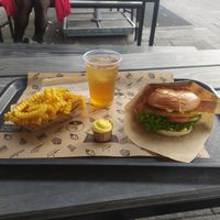 tasty burger with ice tea and fries at VINCENT - Hauptbahnhof Hamburg in Hamburg