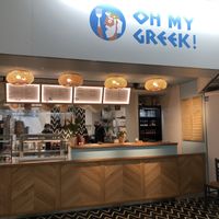 tables without chairs are provided for. at Oh My Greek in Winterthur
