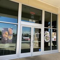 Storefront with operating hours  at The Pho in Modesto