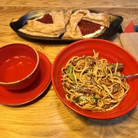 Pancakes and udon noodles with soy “meat”  at Good Food Bowl in Moscow