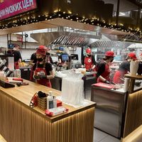 Large team of friendly people creates miracles right in front of you  at Good Food Bowl in Moscow