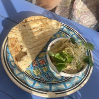 Tomato hummus with bread at Hamsa in Krakow