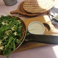 Shakshuka with tofu, tahini sauce and warm bread at Hamsa in Krakow