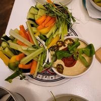 One hummus dish came with 2 bowls of fresh vegetables at Hamsa in Krakow