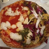 Half vegan margherita half vegan bianca at Chicago Trattoria in Brussels