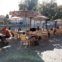 Riverside seating at Zunfthaus zu Pfistern in Luzern