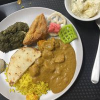 Potato salad, palak paneer, butter chick’n, naan, rice, savoury fried thingy  at Vegie Tribe in Melbourne