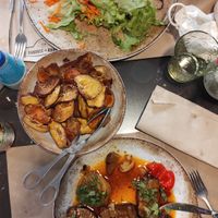 house style seitan with chips, and a salad plate at Sabores ao Rubro in Tomar