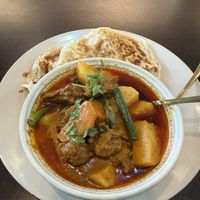 Chicken curry with roti  at Mudita in Auckland