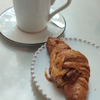 Chocolate cream croissant and macchiato with oat milk at Eutopia in Milan