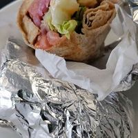 First bite of the BLT wrap at Rooted and Rind in Delmar