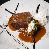 My guest had this for dessert fudge Brownie with whip cream and top with bananas. I had the Mango Rice pudding made from Coconut milk it top off my night   at Chaska in Cranston