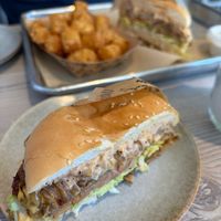 One of the burgers with tots at Loving Hut - Mira Mesa in San Diego