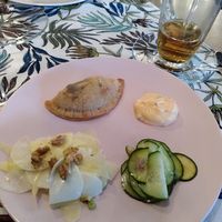 The tasting platter: after a roasted bell pepper soup we got this appel/turnip salad with walnuts, Cucumber with chili, creamy chili sauce and empanada at Natuurlekker in Sprundel