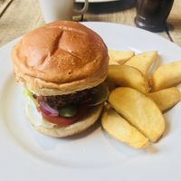 Delicious vegan bbq lentil burger with fat chips & onion rings!  at The Old Mill in Portishead
