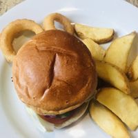 Delicious vegan bbq lentil burger with fat chips & onion rings! at The Old Mill in Portishead