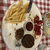 Beyond meat patty (half eaten)  at Agora Greek Restaurant-Bar in Kos