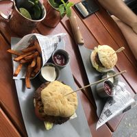 london mules, sweet potatoe fries (standard) w a big and a small burger, vegan mayonnaise, caramelised onions, lentil-beans-patty. Yum!  at Almodo  in Baden