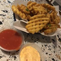 Vegan truffle waffle fries with vegan mayo and red sauce dips   at Square in Newcastle Upon Tyne