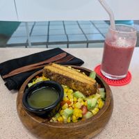 Cornucopia salad with extra tofu and pretty in pink smoothie at Crisp in Roatan