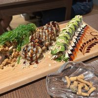 Green Dragon, Black Mushroom Truffle, and another sushi maki. Also, mushroom snacks.  at WAKI WAKI Veggie Sushi in Bangkok