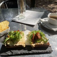 Americano, toast with hummus and sundried tomatoes 🍅   at Casa de Chá  in Coimbra