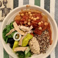 Moroccan Mirage bowl - Quinoa, chickpeas, coconut kale, hummus, olives, tofu feta, and more! at Plant Junkie - Vanderbilt in New York City