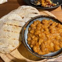 Beans and homemade pita  at OhniskO Fire Dining & Brew Bar in Kosice