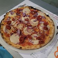 Half-dried tomatoes, pine nuts, red onion and vegan mozzarella at Levante Pizza E Birra Rubiu in Cagliari