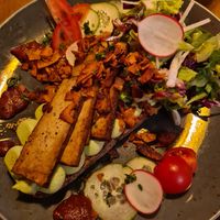 Bread with pea-cream, smoked tofu, salad and "coconut bacon". Absolutely delicious at Zweibar in Essen