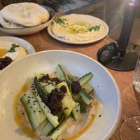 Cucumber, with baba ganoush in the background   at MITTS in Amsterdam