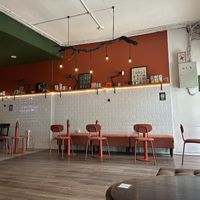 The backyard seating space   at Mad Grass Collaborative Space and Cloud Kitchen in Jakarta