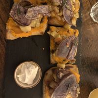 Potato pizza with (surely violife) cream cheese on the side   at Sonflour in Cork