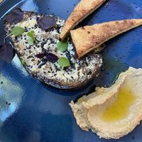 Almond meal crusted roasted 🍆 with tofu & homemade hummus  at Schwung und Schwebe in Leipzig