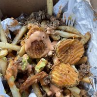 Fried pickles on loaded fries   at Solár: A Vegan Eatery in Tempe