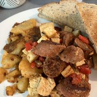 Tofu scramble with plant-based sausage. (Second day!)  at The Tuscan Cafe in Warwick
