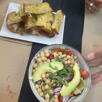 Garlic bread and chickpea-avocado salad  at Fangas Veg in Coimbra