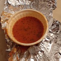 Madras Rasam: spicy red tomato/lentil soup with a lot of garlic, south Indean style  at Goa India in Gottingen