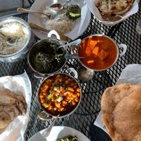 Vegan Alu Palak, Vegan Tofu Masala, Vegan Chana Masala, Roti, Puri, and (not vegan) garlic naan. at Jaipur Indian in Boulder