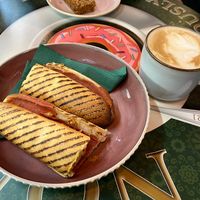 Pastrami panini and oat latte   at Nonna's Deliciously Different in Swansea