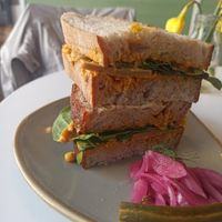 Miso-glazed SoyAhoy chi*cken, smoky corn relish and baby spinach. at One B Coffee House - Cotham Hill in Bristol