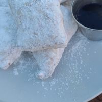 Beignets with raspberry coulis  at Picasso Cafe on Paseo in Oklahoma City