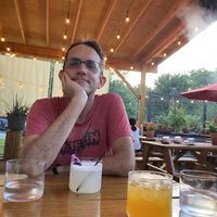 Covered patio with lights and misting fans  at Llama Queen in Austin