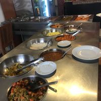 Vegan options in the circle bowls, meat options in the rectangle bowls  at Maikhana in Cusco
