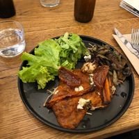 Chilaquiles (fried tortilla, salsa, vegan cheese (mozza and feta), mushrooms and vegetables )  at La Main Noire  in Paris