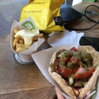 Chips with mayo, falafel pita wrap (mild coriander sauce)  at Maoz - Damrak in Amsterdam