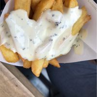 Fries with garlic sauce 😍 at Maoz - Damrak in Amsterdam
